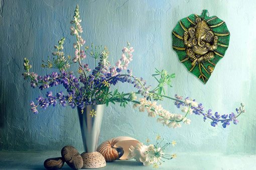Green Metal Lord Ganesha on a Leaf Wall Hanging