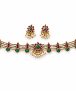 Antique gold ruby and green stone choker set with matching earrings on white background