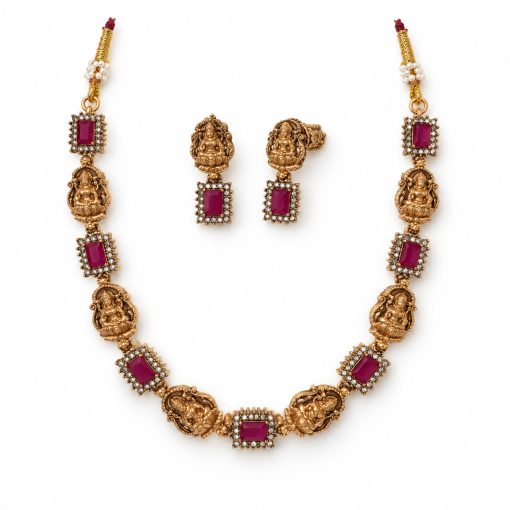 Antique Gold Ruby Lakshmi Temple Choker Set with Earrings Antique gold ruby Lakshmi temple choker set with matching earrings on white background