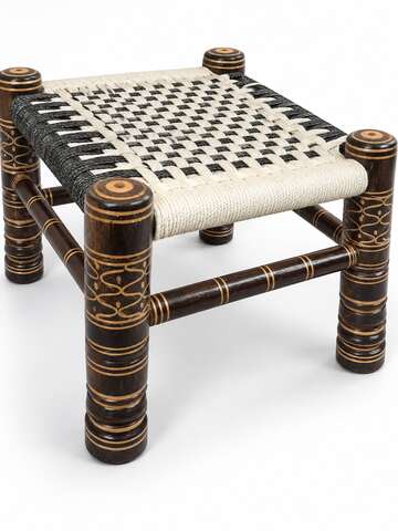 White and black woven wooden Khatli stool professional side view