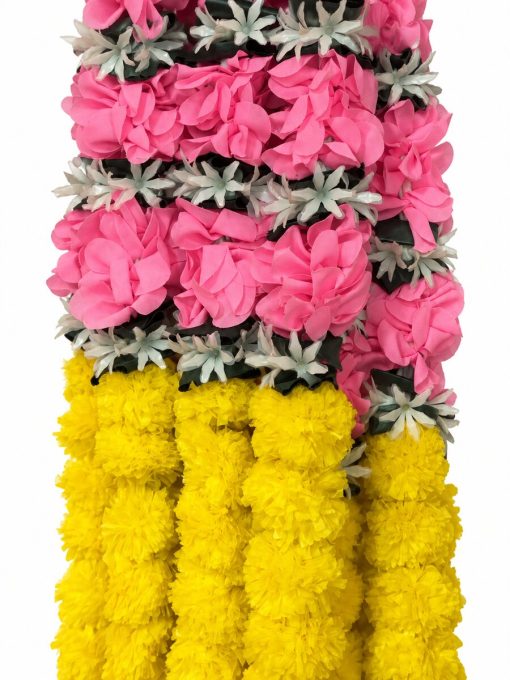 Close-up of irregular pink fabric petals, white star flowers and yellow strands