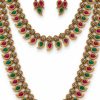 Close-up of ruby and green mango motif necklace and matching earrings