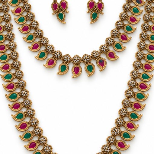 Close-up of ruby and green mango motif necklace and matching earrings