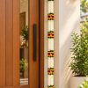 White artificial flower long toran displayed beside a home doorway