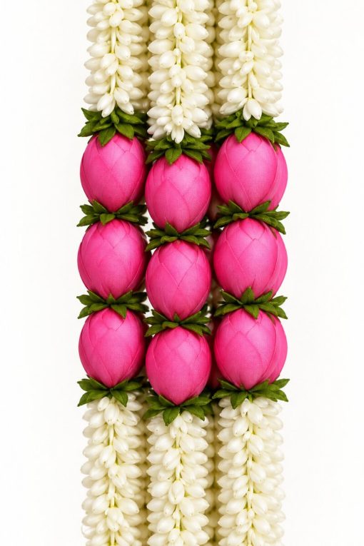 Close-up of white artificial flowers and pink lotus buds