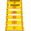Yellow seven-step Golu stand with traditional kolam and lotus designs