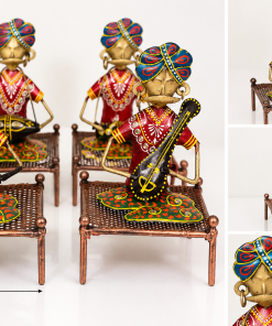 Handcrafted metal Rajasthani musician figurine on decorative charpai
