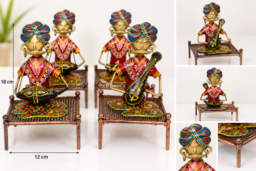 Handcrafted metal Rajasthani musician figurine on decorative charpai