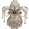Decorative Silver-Tone Pooja Kalash with Coconut and Mango Leaves Silver-tone decorative pooja kalash front view